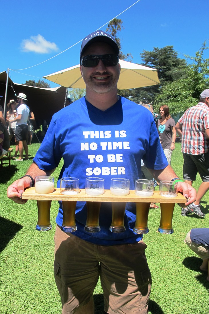 This guy and his friends are the best-prepared beerfest-goers I've ever seen, equipped not only with matching t-shirts but also a beer-carrying plank for easy bulk purchases